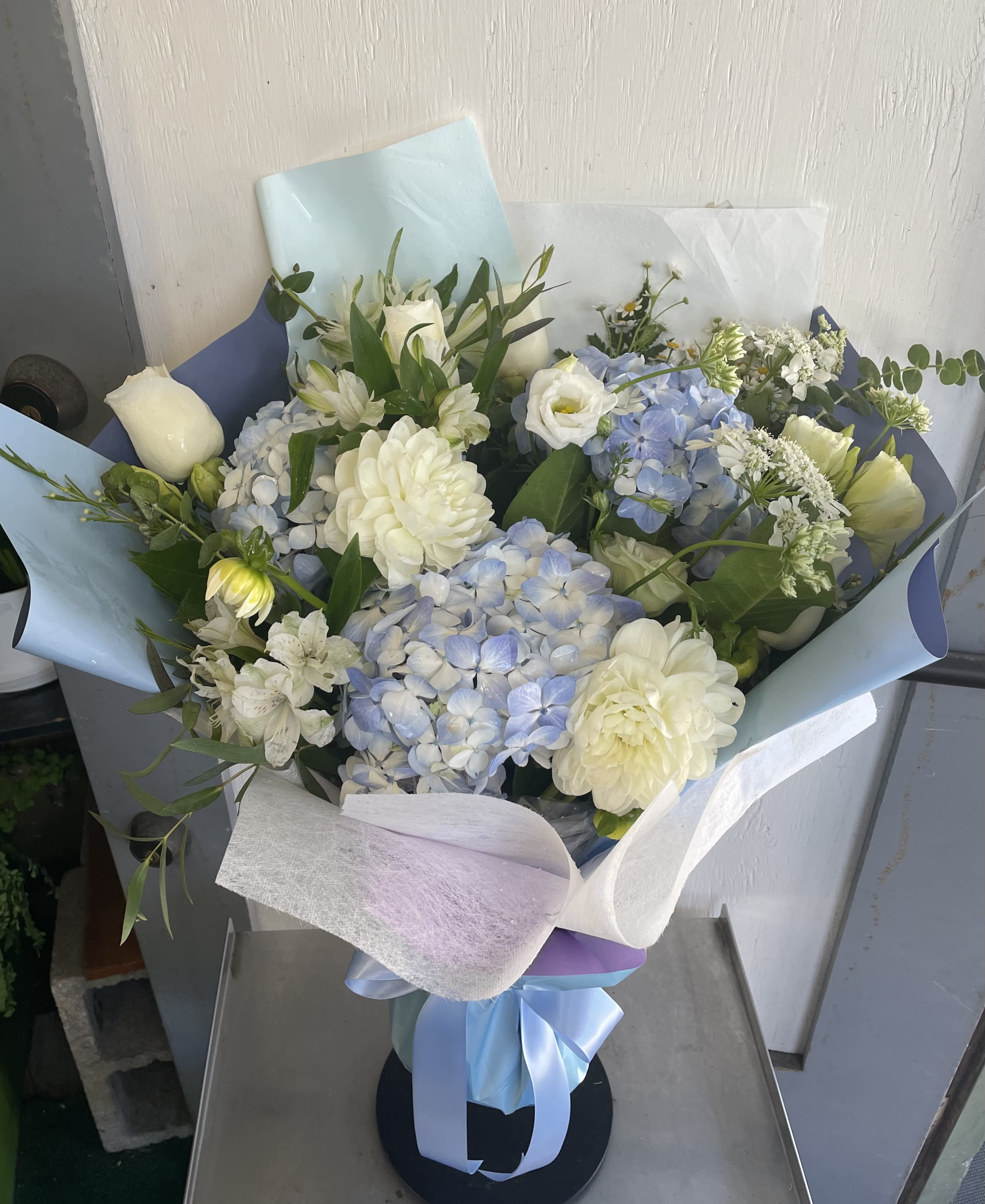 Love And Romance #19 - A beautiful display of white and blue flowers wrapped in the Hong Kong style