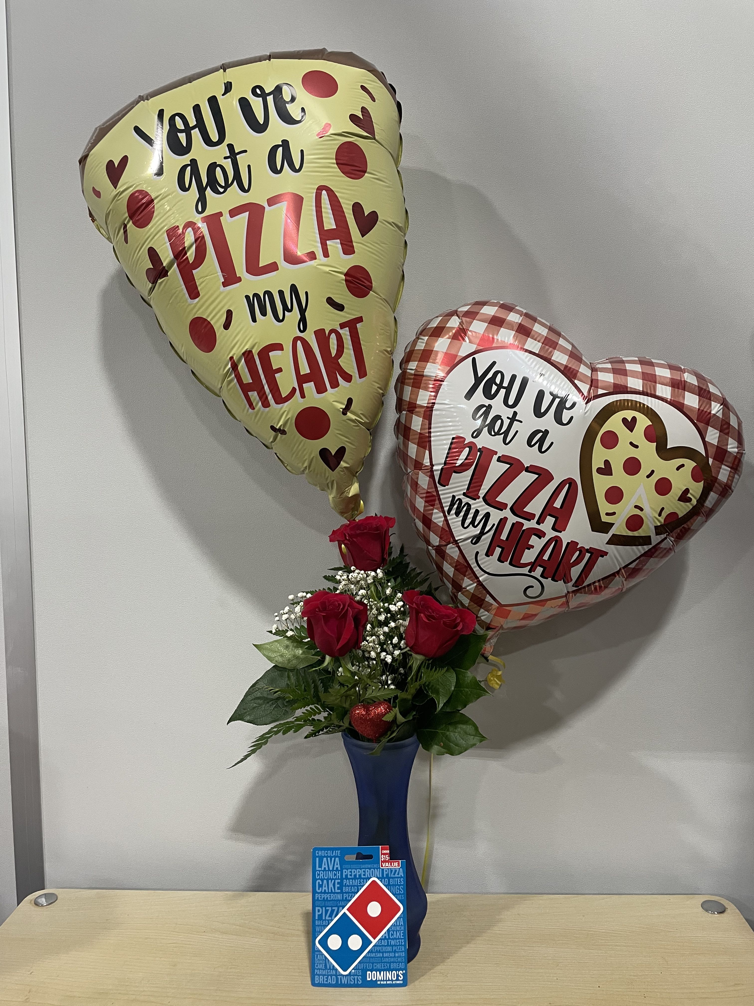 Roses in a blue vase with pizza-themed heart balloons and a Domino's gift card