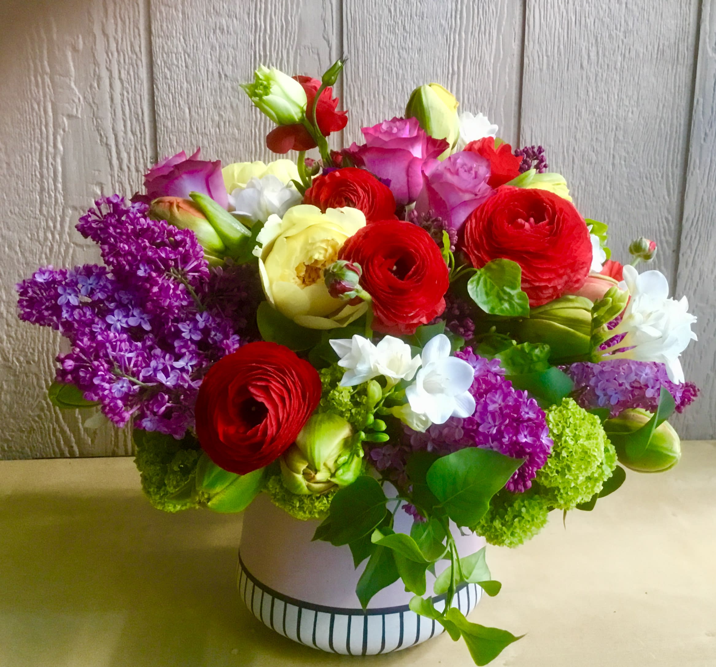 Bridget Jones's Diary - Lilac, roses,freesia, peonies,renunculus , french tulips in a beautiful pink ceramic vase will be delivered by Jane"s Roses Floral Design Studio in San Francisco