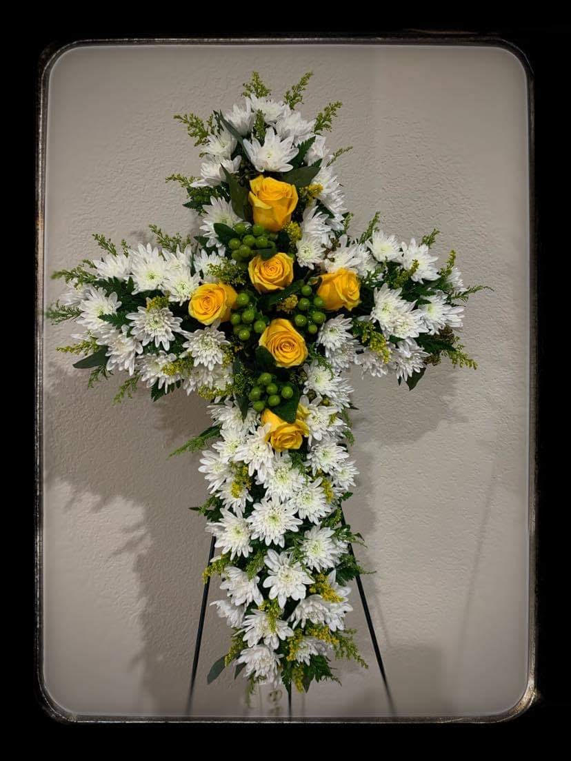 Cross-shaped floral standing spray with white daisies and yellow roses