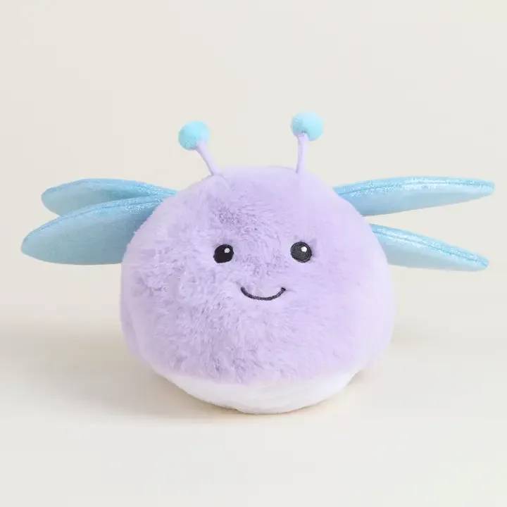 Round lavender plush toy with blue wings and antennae