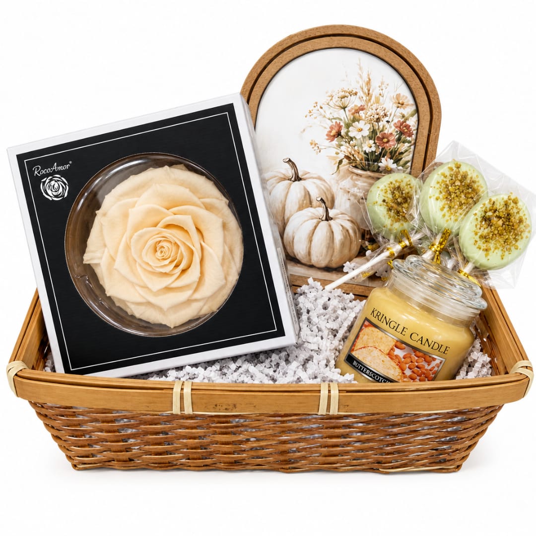 Gift basket with a rose-shaped item, lollipops, and a candle in a wicker basket
