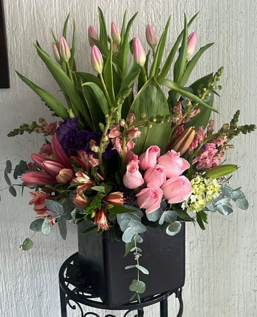 Luxury Pink Tulips, Roses &amp; Lilies Flower Arrangement - Celebrate every special moment with our Luxury Pink Tulips, Roses &amp; Lilies Flower Arrangement, an elegant garden-inspired design handcrafted by Snyder Flowers. This premium arrangement combines graceful pink tulips, blush pink roses, fragrant lilies, snapdragons, alstroemeria, fresh eucalyptus and seasonal flowers in a stylish black keepsake container.  Its romantic colors and modern design make it a perfect gift for birthdays, anniversaries, Mother's Day, congratulations, thank you gifts, new baby celebrations, housewarmings, thinking of you wishes, get well soon messages, or simply to surprise someone special.  Each arrangement is handcrafted using premium fresh flowers and is available with same-day flower delivery in San Antonio, including Stone Oak, Alamo Heights, The Dominion, Shavano Park, Castle Hills, Medical Center, Leon Valley, Helotes, Schertz, Cibolo, Live Oak, Universal City, Boerne and surrounding areas.  Trust Snyder Flowers, your local florist in San Antonio, for luxurious floral designs made with exceptional quality and attention to every detail.