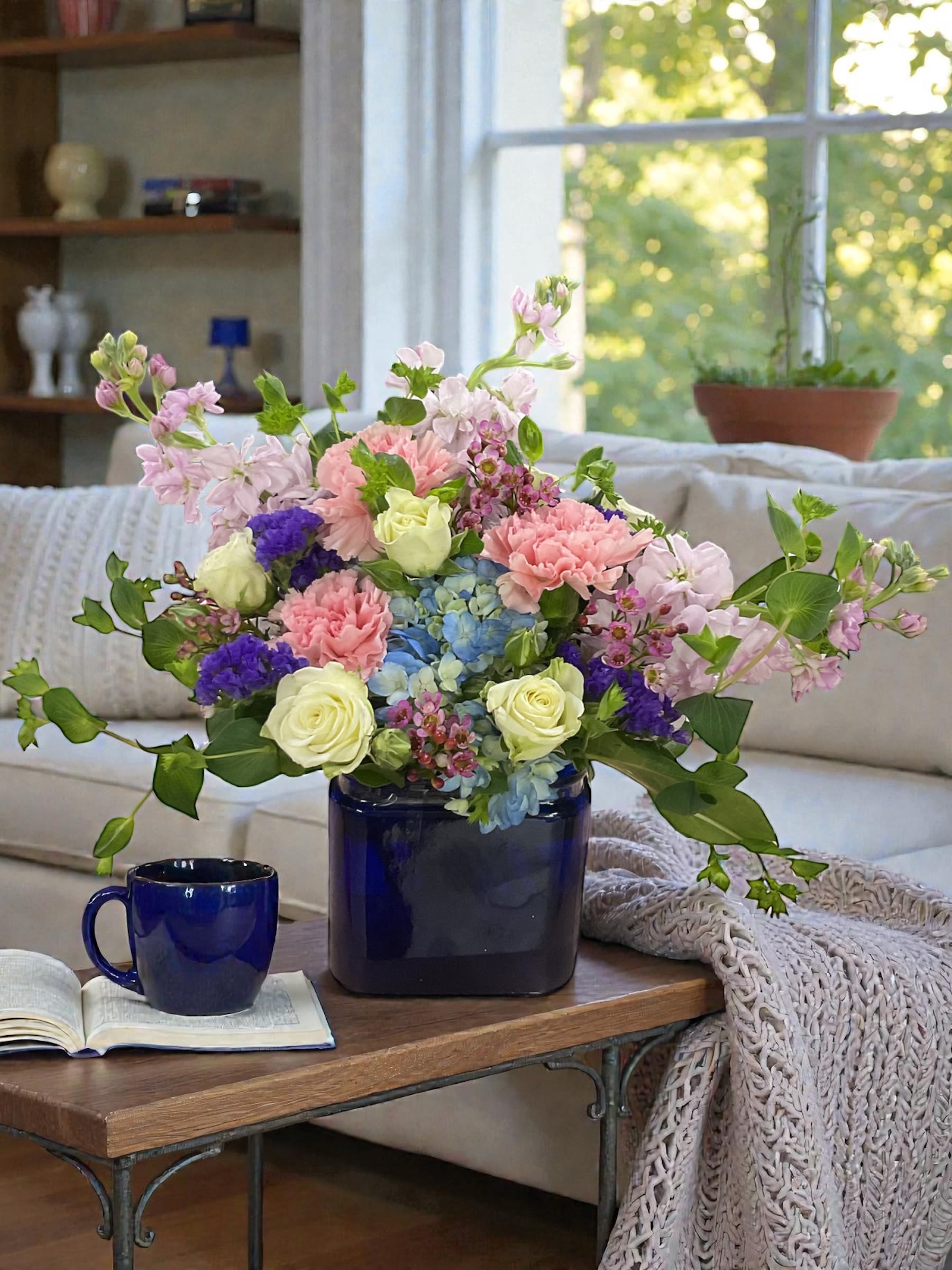 Awakening Dawn Arrangement  - Awakening Dawn Arrangement is a soft, elegant floral design created in soothing shades of blue, lavender, blush pink, and fresh green. Inspired by the quiet beauty of winter giving way to spring, this arrangement brings a sense of calm, hope, and renewal to any room.  Designed with a lush mix of fresh seasonal flowers and airy texture, Awakening Dawn is a versatile gift choice for birthdays, get well wishes, thank you gifts, new baby celebrations, sympathy gestures, or simply letting someone know you’re thinking of them.  Every arrangement is handcrafted to order using the freshest flowers available. While specific blooms may vary based on season and availability, the overall color palette, style, and balanced garden feel will remain true to the design shown.  Available for local flower delivery and in-store pickup from Aspen Tower Florist in Greensburg, Indiana. We proudly serve Greensburg, Batesville, Rushville, Shelbyville, Hope, Westport, North Vernon, New Point, and surrounding Southeast Indiana communities with fresh, professionally designed flowers for every occasion.  Choose Awakening Dawn when you want to send beauty, comfort, and brighter days ahead.