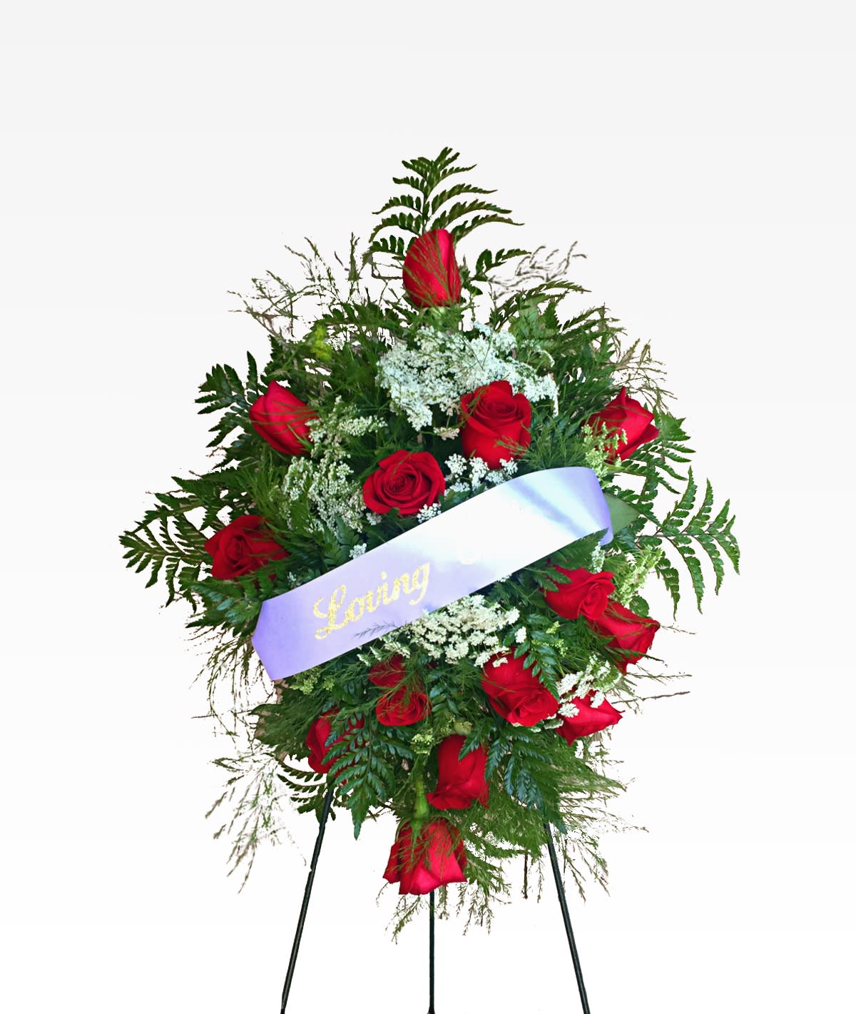 Standing spray of red roses with a lavender ribbon
