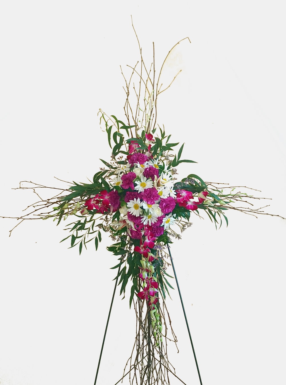 Tall floral standing spray with pink and white flowers on a tripod easel