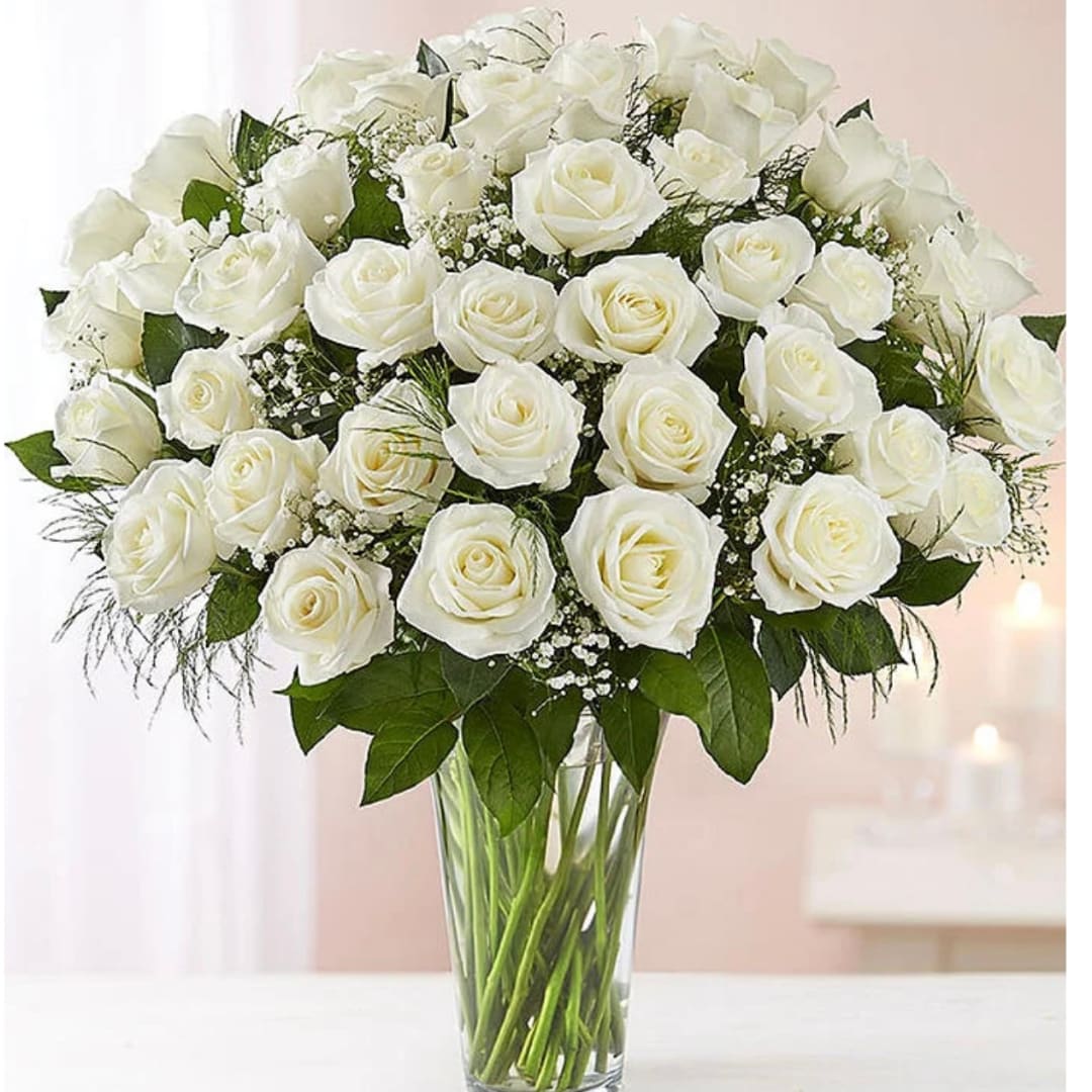 White rose bouquet in a clear glass vase