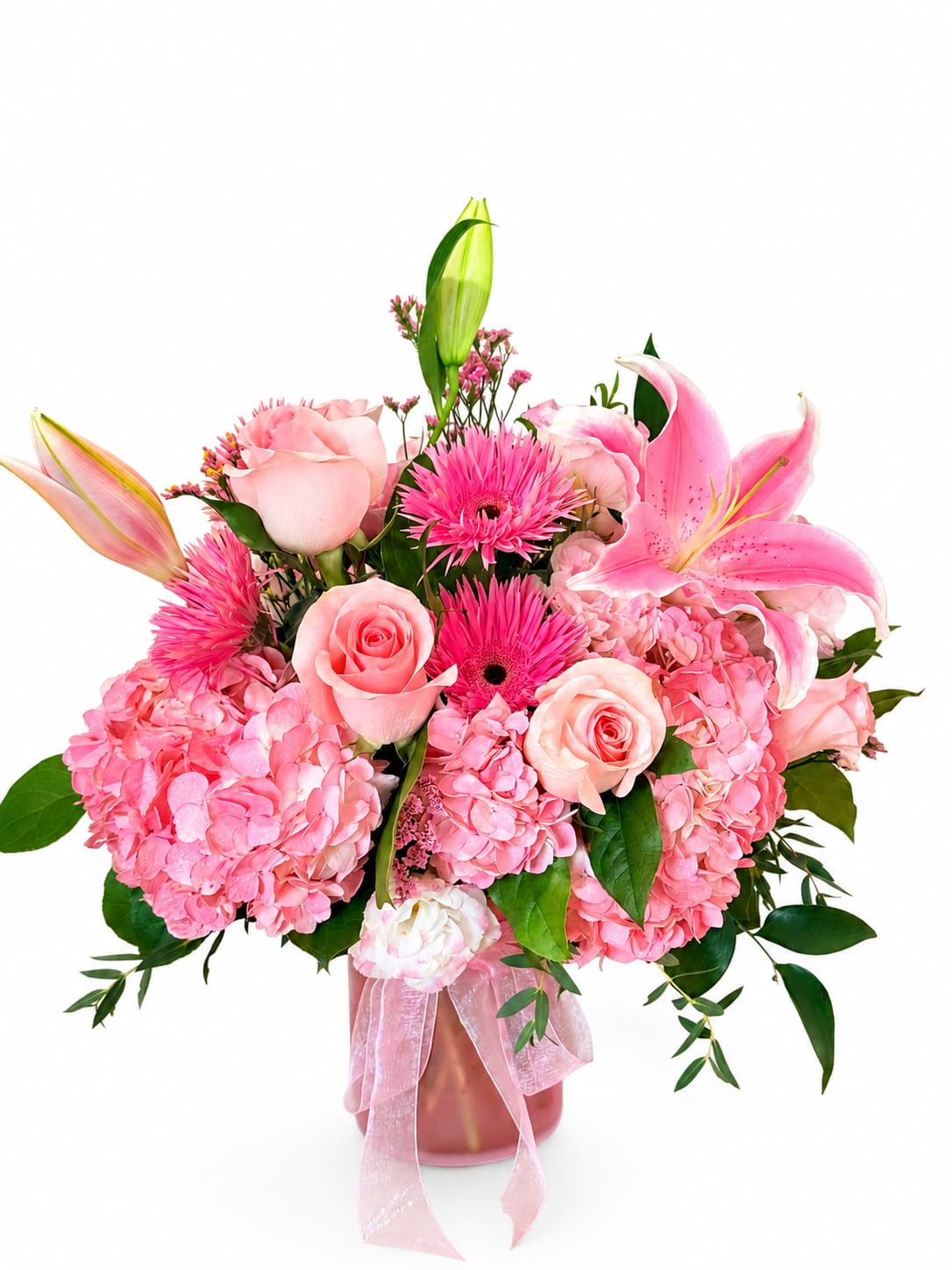 Pink Dream -  A charming pink arrangement featuring hydrangeas, blush roses, pink lilies, gerbera daisies, and fresh greenery in a keepsake vase. Perfect for birthdays, baby showers, anniversaries, or any occasion that calls for a touch of elegance.