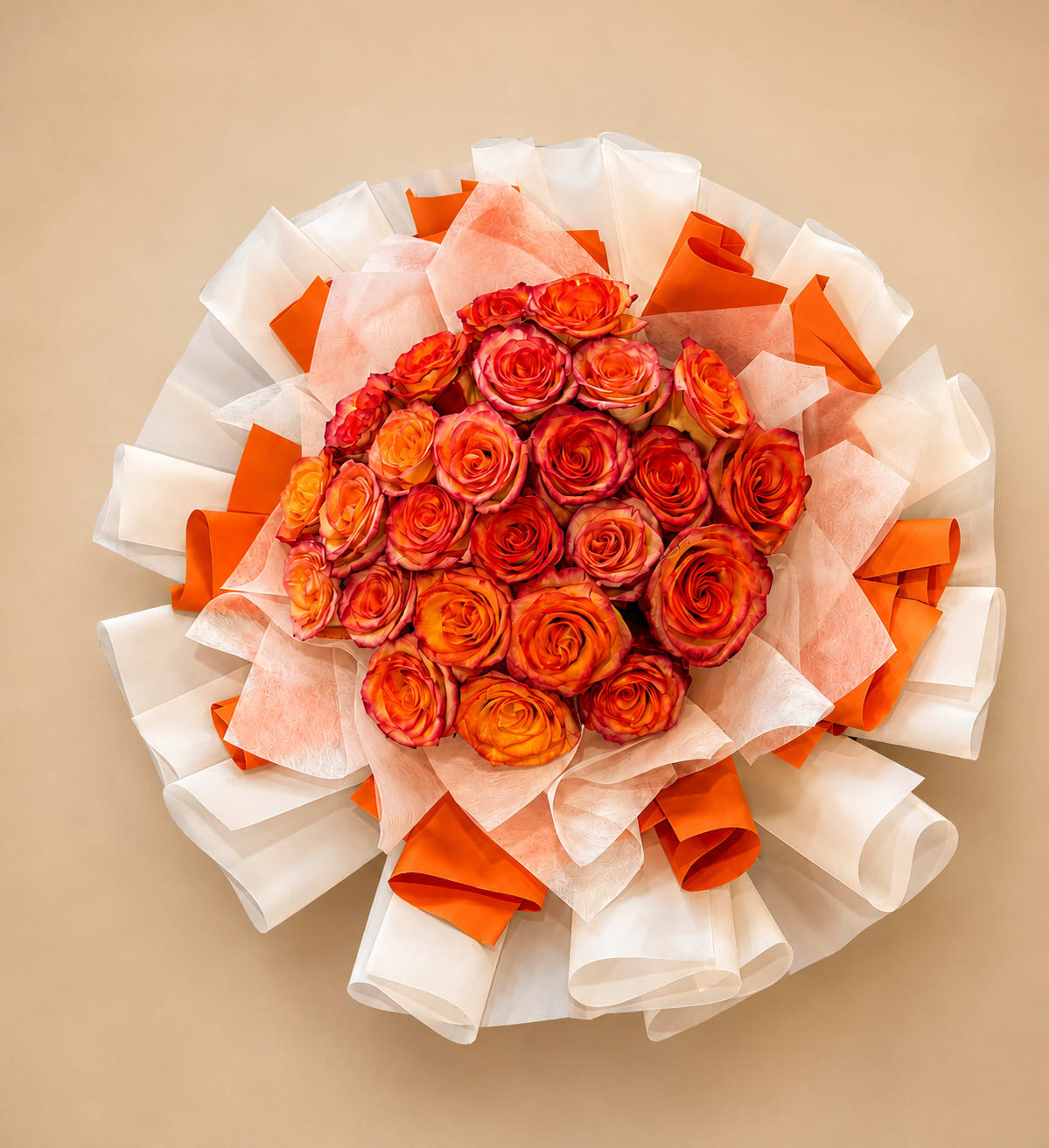 Tangerine Kiss - A hand-tied bouquet of 25 Ecuadorian premium roses in vibrant sunset shades, wrapped in elegant white, pastel yellow, and orange layers for a fresh, modern look. Perfect for birthdays, anniversaries, or any special celebration.