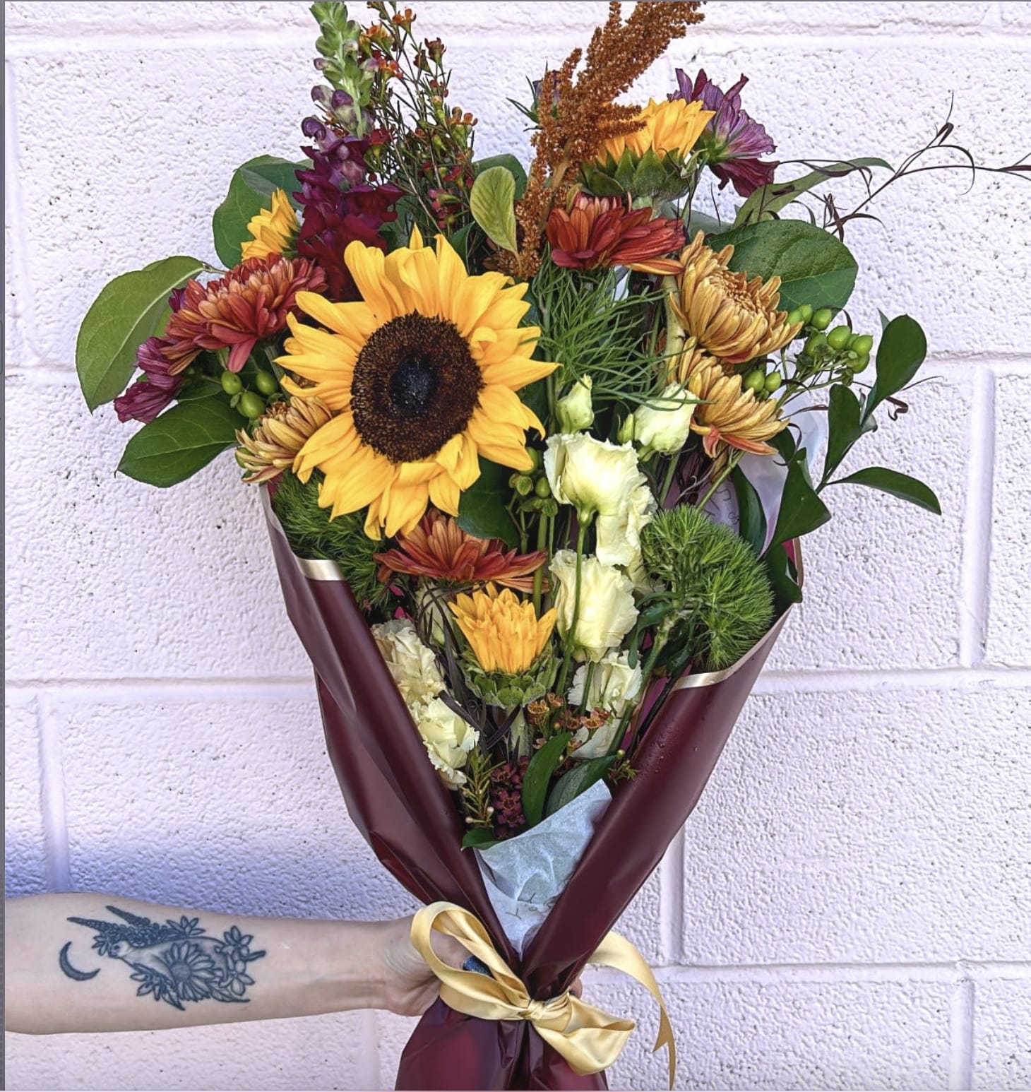 Wrapped Autum Florals - No Vase - This hand wrap of autumn florals are sure to make anyone's day! This arrangement does not come in a vase, but it does come in a "wet wrap" underneath. Next, go grab a Pumpkin Spice Latte please! 