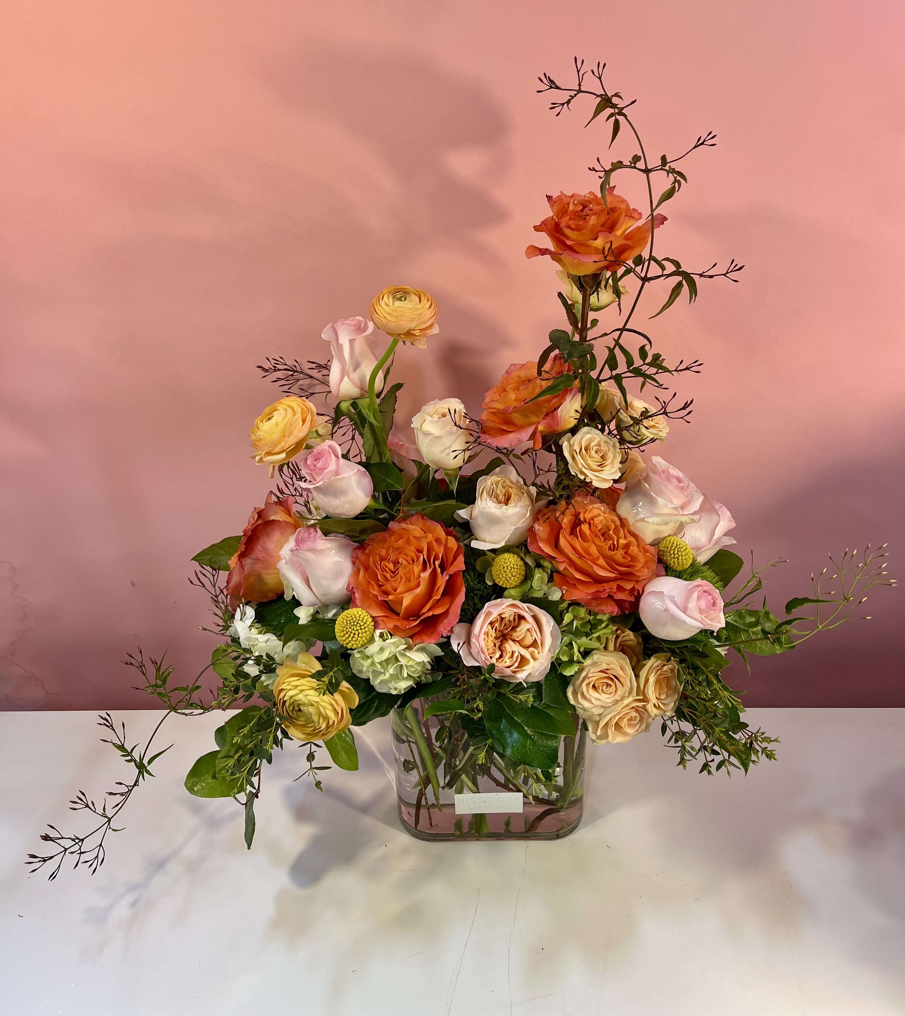 Tig's Tail - This designer's choice texutred and varied height arrangment is sure to make heads turn and tails bounce! This fragrant is colorful arrangement is hand crafted in Las Vegas by our local team using the freshest high end florals from around the world. Our arrangements are created with love and delivered with care for you!
