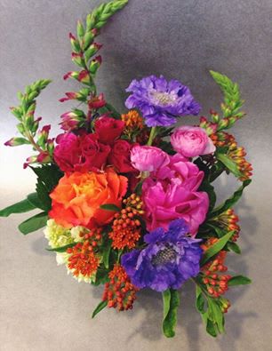 Colorful bouquet with pink, orange, purple, and red flowers