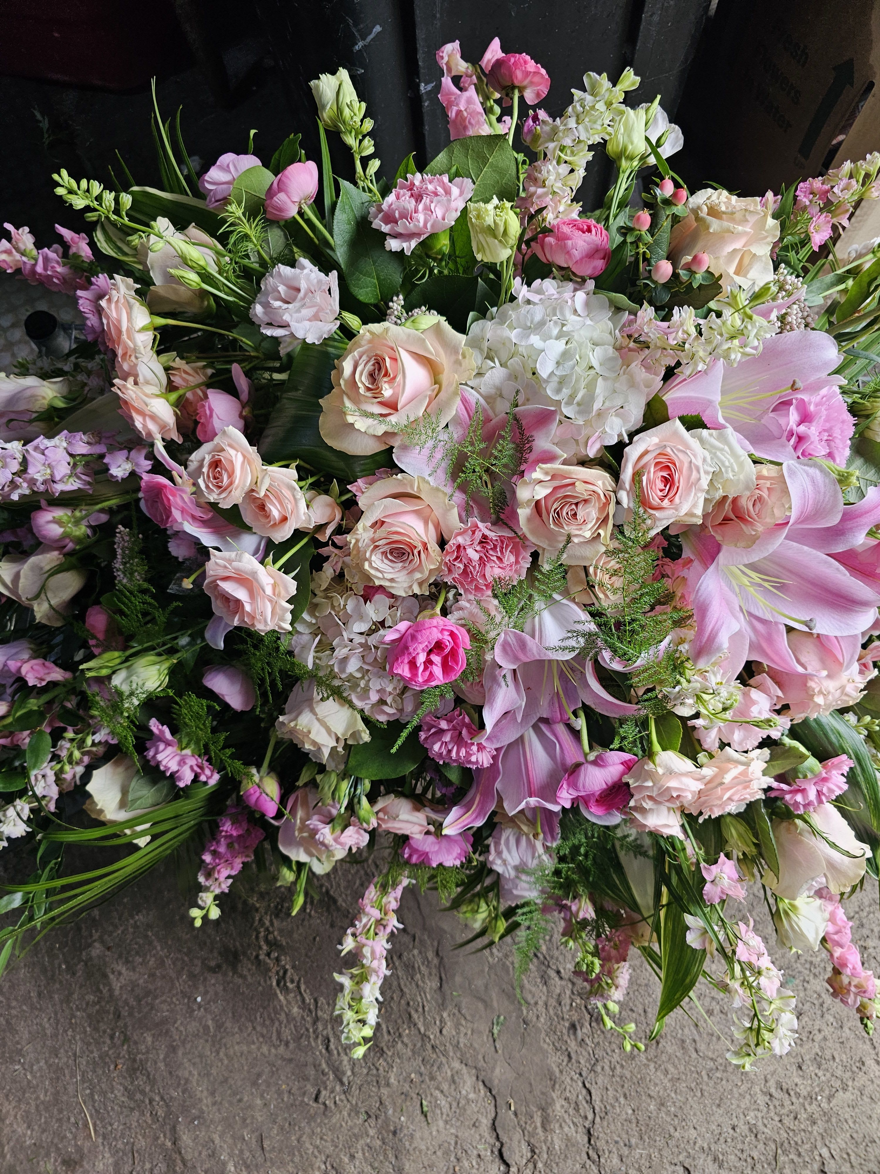 Large pink and white mixed bouquet with roses, lilies, and hydrangeas