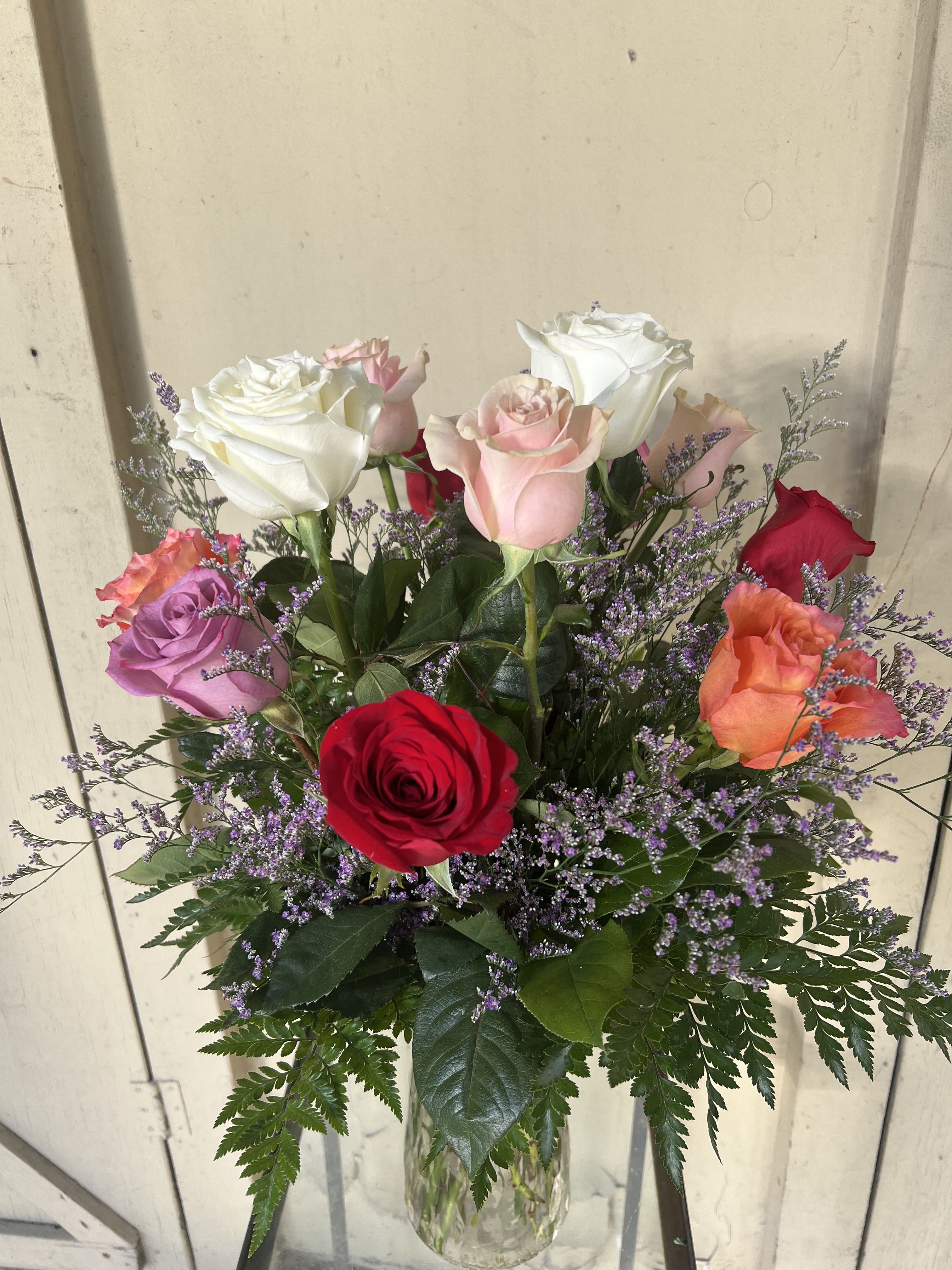 Colorful Mixed Roses  - The roses are artfully arranged in a classic vase and accented with delicate filler flowers such as baby’s breath, wax flower or limoniuim. Because colors are designer’s choice, every arrangement is unique—crafted with care and creativity to ensure a beautiful, fresh display perfect for any occasion. if you have a preference for a rose color please let us know!