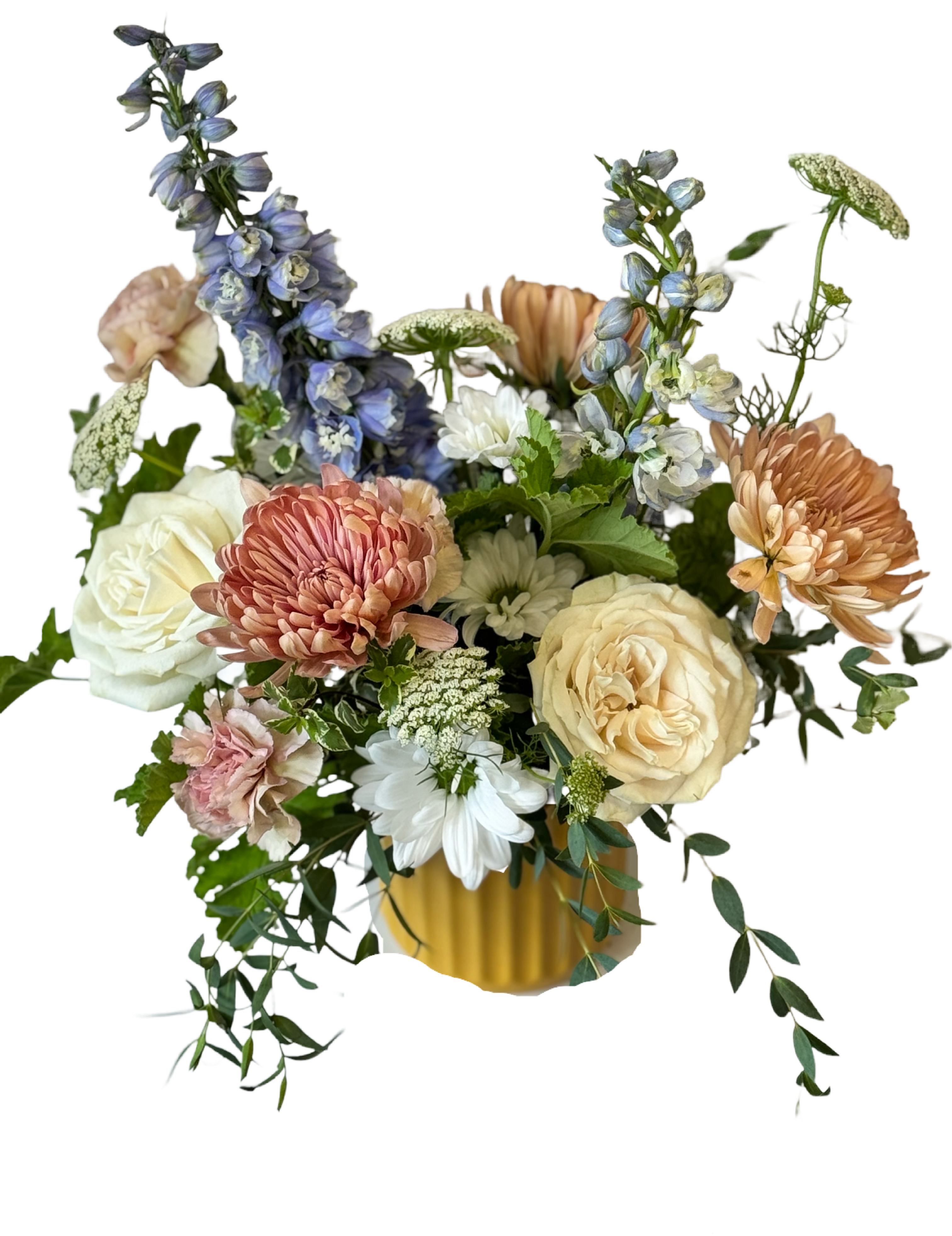 Mixed bouquet of roses, chrysanthemums, and blue delphinium in a yellow vase
