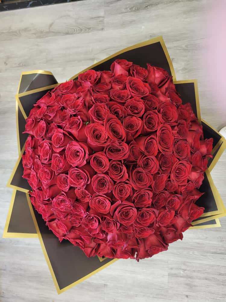 150 LARGE red rose bouquet - The red rose is perhaps the most enduring and universal symbol of love and passion, cherished across cultures and centuries. Its rich, vibrant hue and delicate petals evoke deep emotions, making it a timeless emblem of romance, devotion, and desire.     Featuring 150 of the finest red roses, wrapped in a black and gold paper.