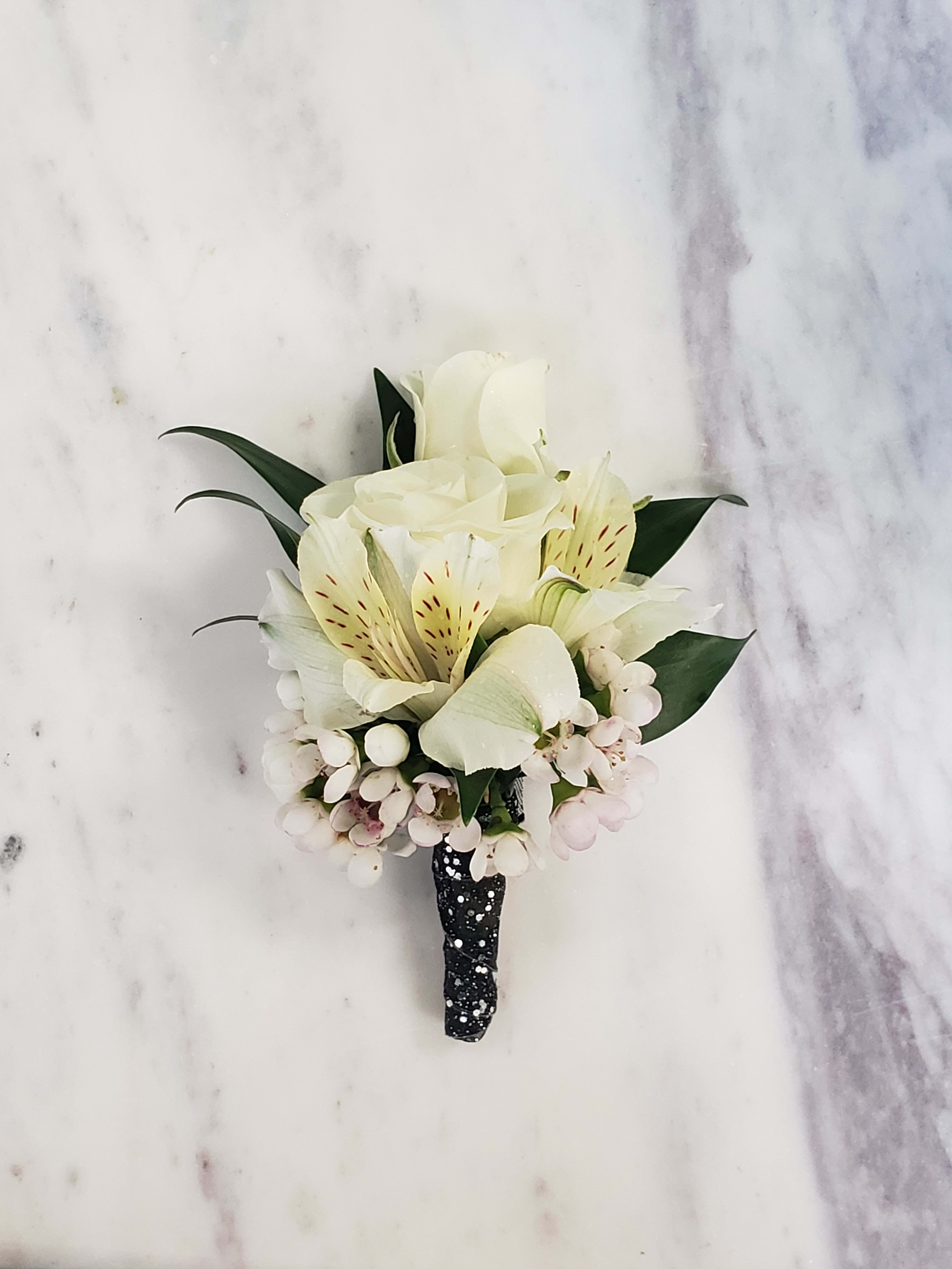 Design your own boutonniere - In the notes section, specify flower color and stem wrap color. Flower colors available are white, light pink and red (darker red, not bright red). Stem wrap colors available are white, black, light pink, silver, gold, dusty blue, navy, royal blue, dusty rose.  Call the shop if you would like something more specific 616-888-0219