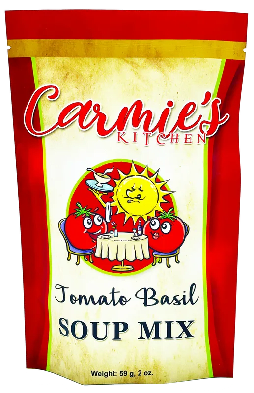 Carmie's Kitchen Tomato Basil Soup Mix pouch with cartoon tomatoes at a table