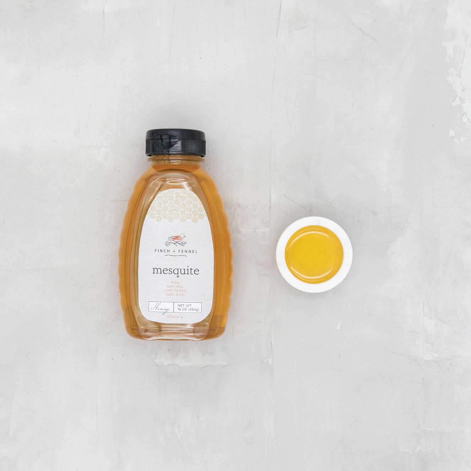 Finch + Fennel 16 oz. Grade A Unfiltered Mesquite Honey - Our Mesquite Honey provides a unique yet subtle combination of floral and earthy tones. Perfect on whole grain breads, charcuterie boards, or as a glaze on meats. 