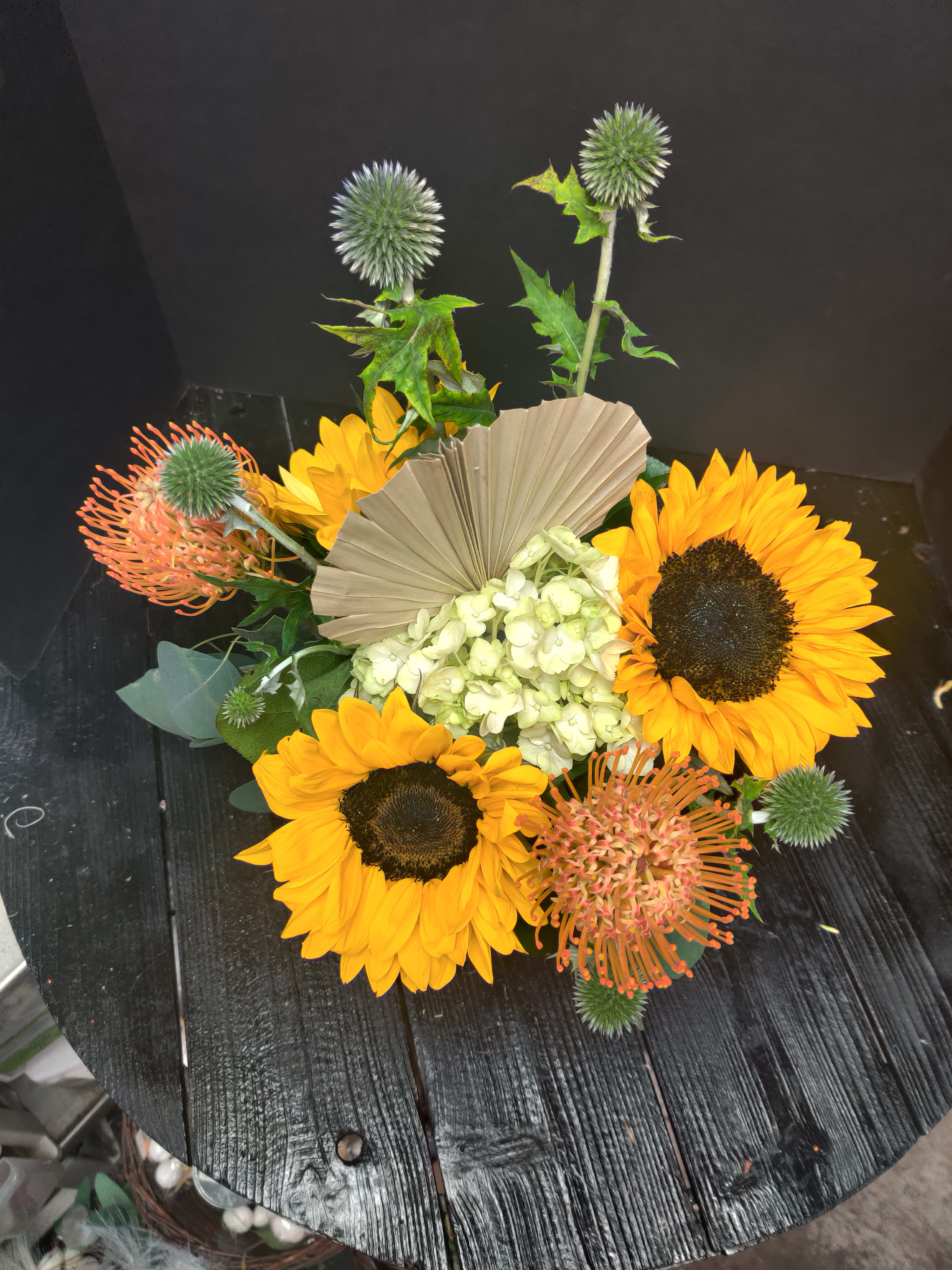 Fall Delight  - Sunflowers, protea, and thistle is the composition of color perfect for any gift.