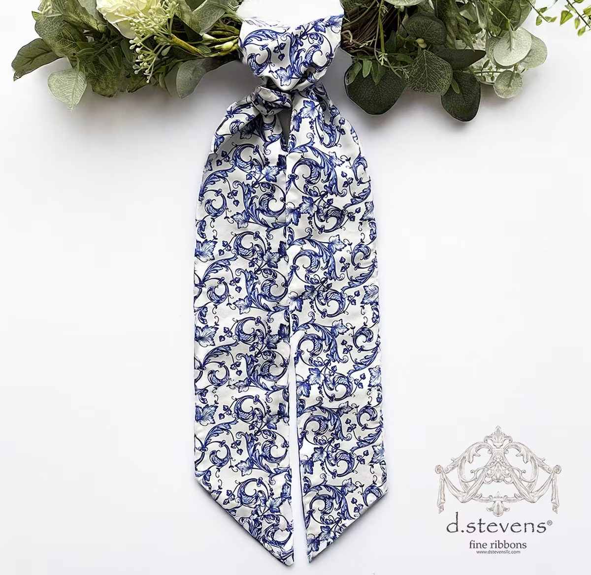 D Stevens taffeta acanthus scroll chinoiserie sash, royal blue white - 4" x 56"  Wreath sashes are used as a decorative element in premade wreaths to add a touch of elegance or color. The sash can be tied in a bow or draped artistically through the wreath for a polished look.