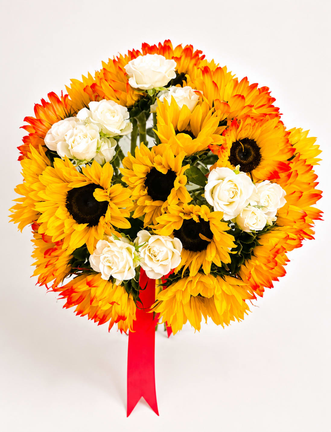 Bouquet of yellow sunflowers and white roses with a red ribbon