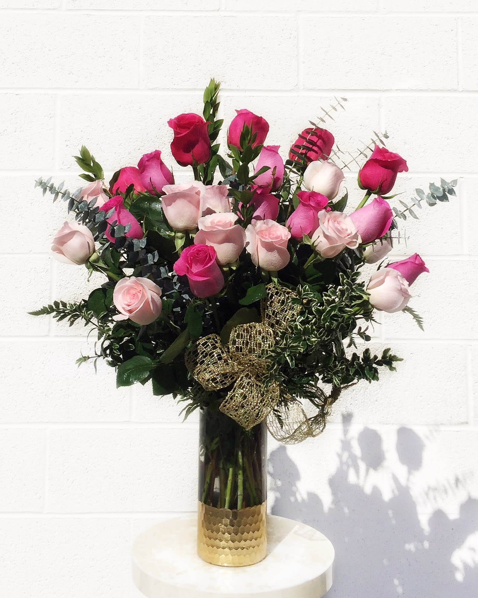 Sweet Love - Premium Ecuadorian assorted pink roses with accents in a nice glass vase. STANDARD: 24 ROSES DELUXE: 36 ROSES PREMIUM: 48 ROSES