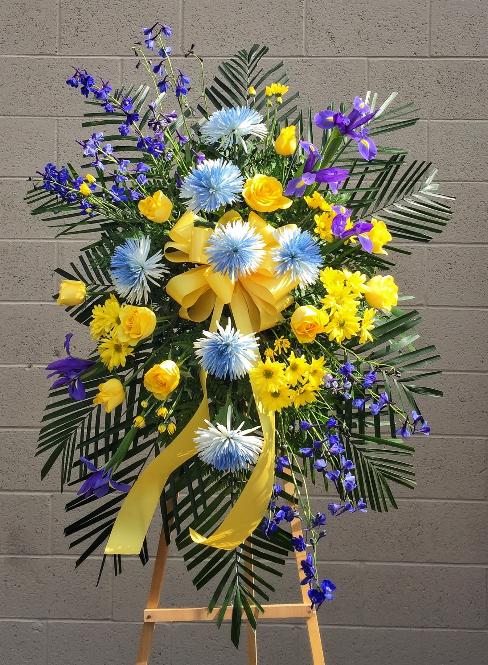 Funeral Spray 4 - Funeral spray with yellow and blue fresh flowers STANDARD: FIRST PHOTO DELUXE: SECOND PHOTO