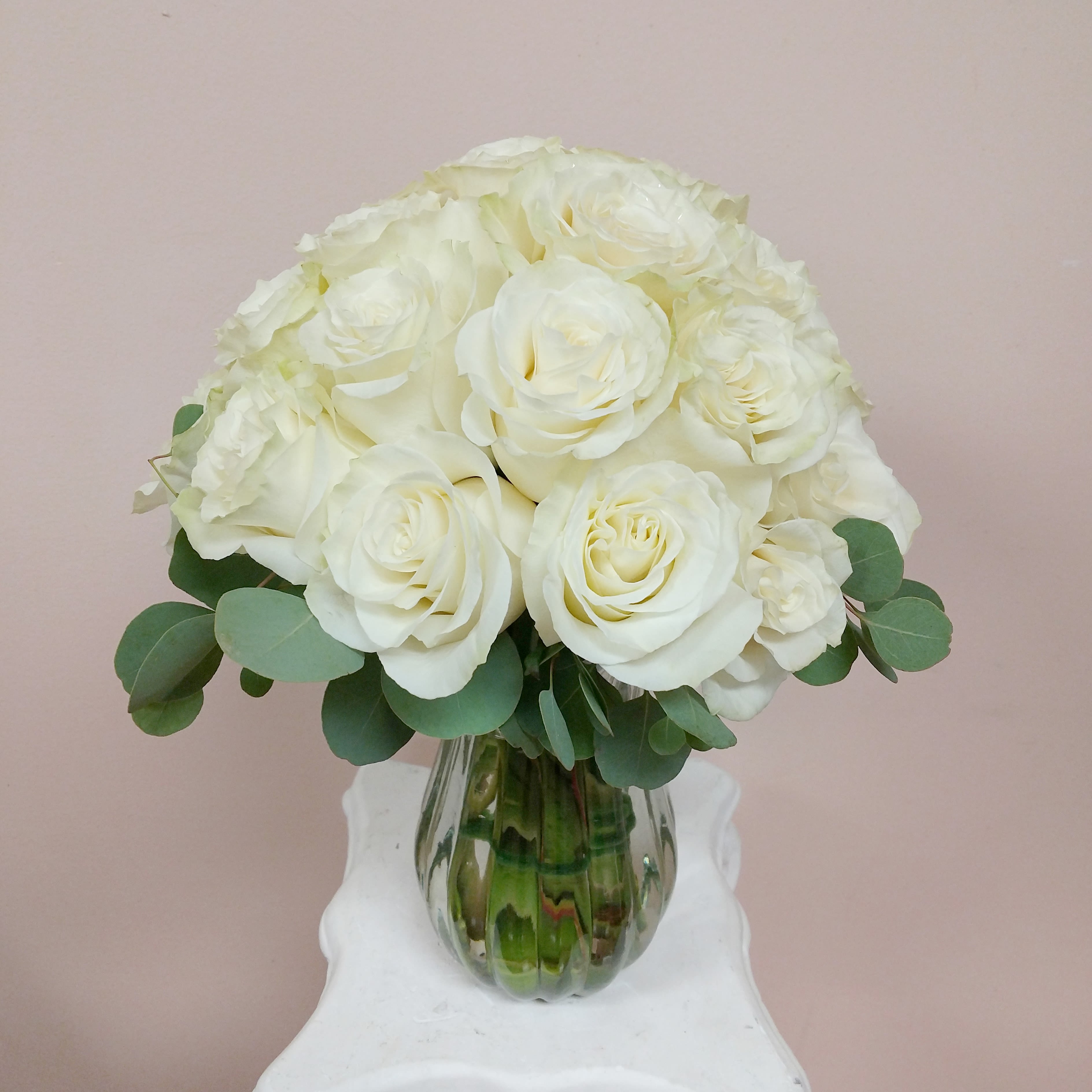 2 Dozen Perfect White Rose Bouquet - This 24 white Mondial rose bouquet says it all when sending your condolences to a grieving family. These roses are full in size and will last several days. 