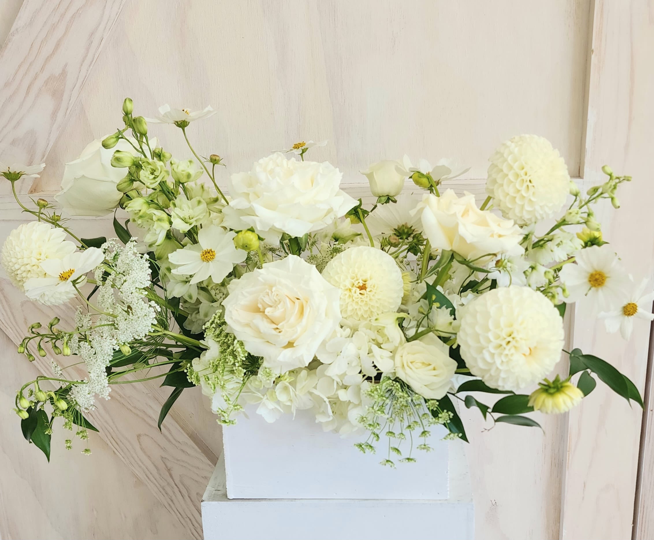 White floral arrangement in a rectangular white box