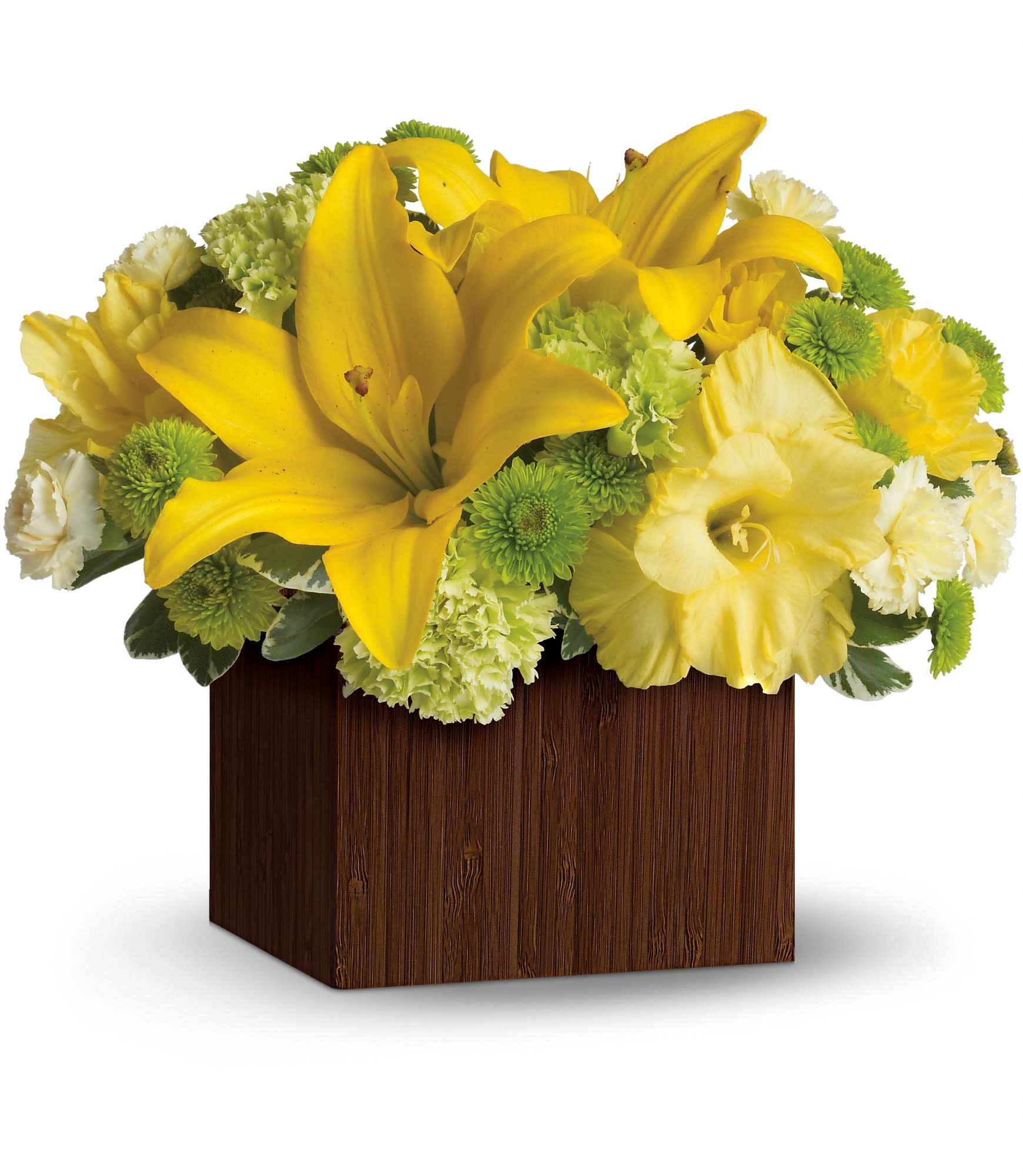Low arrangement of yellow lilies and mixed yellow, green, and white flowers in a brown wood box