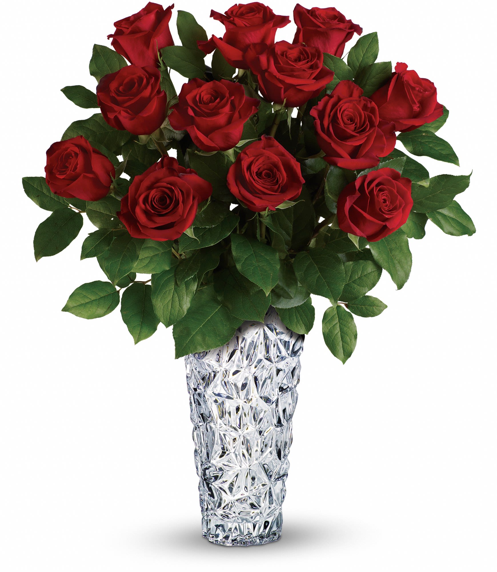 Arrangement of long-stemmed red roses in a tall textured clear glass vase
