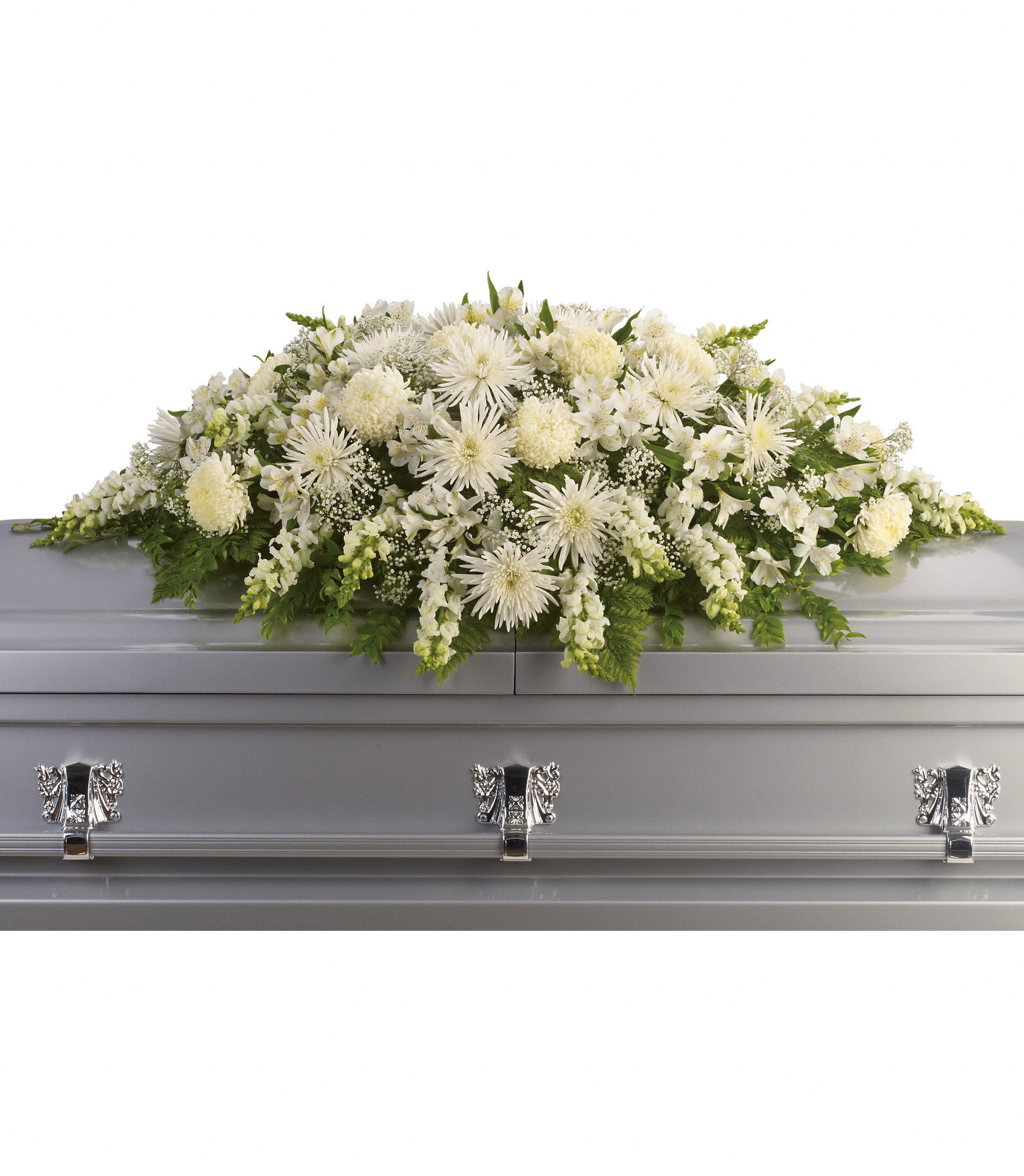 All-white casket spray of mixed flowers on a silver casket
