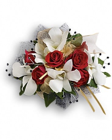 Red roses and white orchids in a compact bouquet