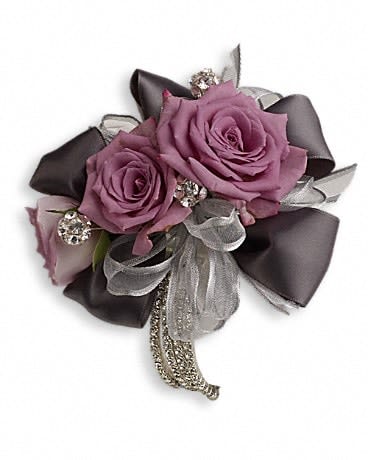 Purple rose corsage with silver ribbon and rhinestone accents