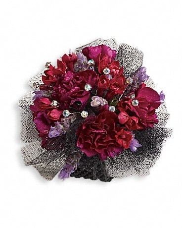 Bouquet of deep pink and purple flowers with black-and-white mesh wrapping