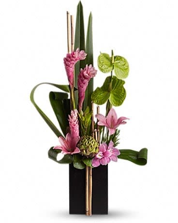 Pink tropical flowers arranged in a tall black vase