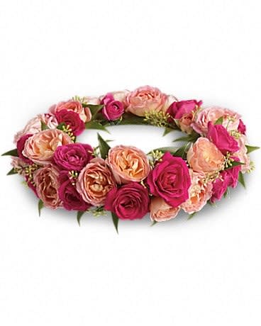 Pink and peach rose floral wreath on a white background