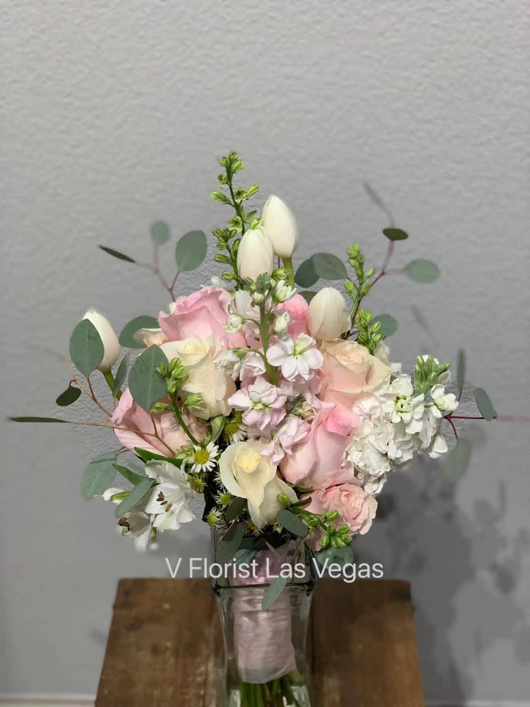 Pink and white bouquet in a clear glass vase