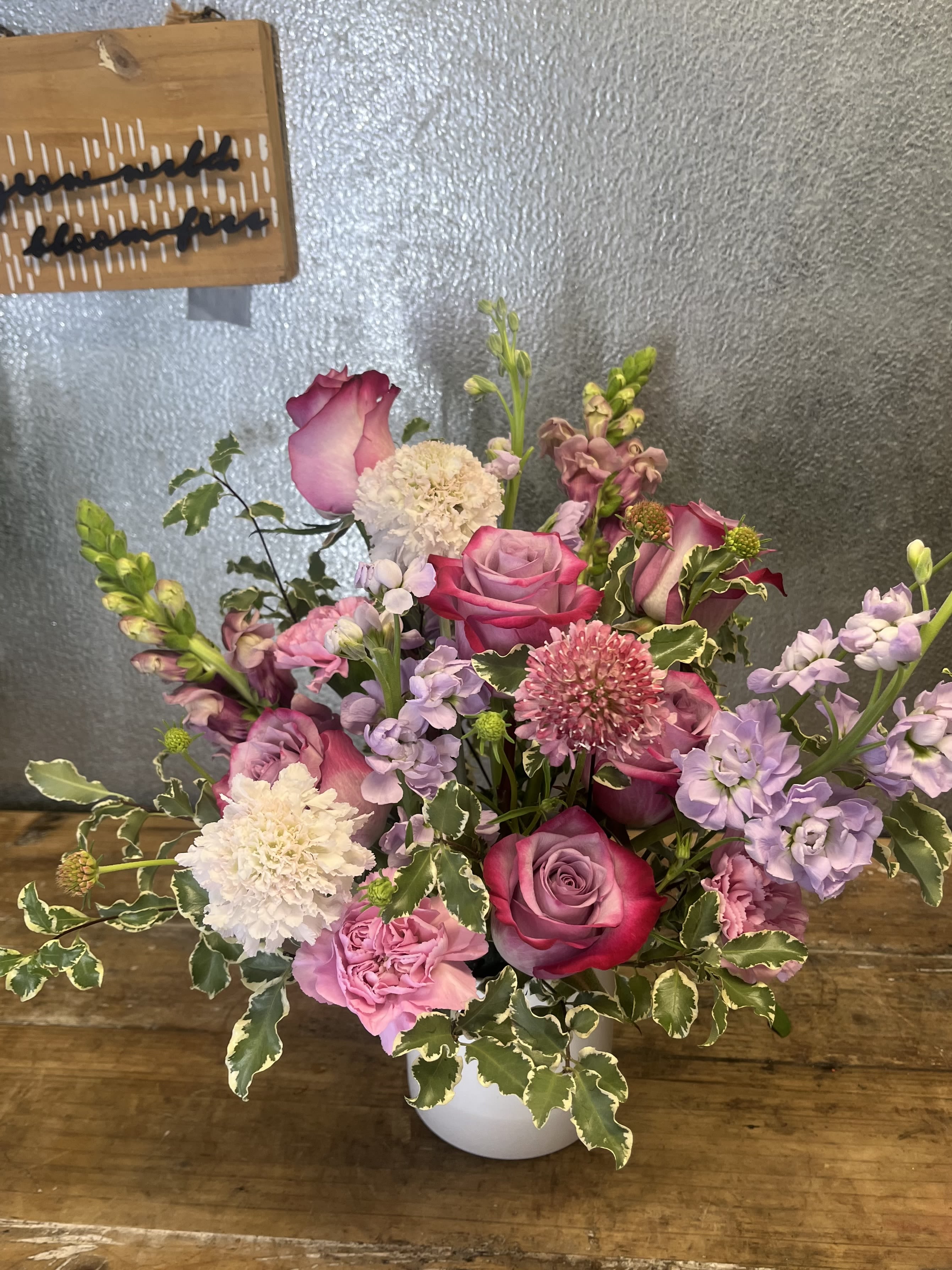 Lavendar Fields - A garden-style arrangement featuring a soft mix of lavender and pink blooms, gently accented with delicate white flowers and airy greenery.