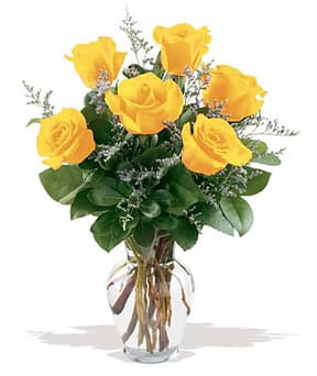 Yellow roses arranged in a clear glass vase