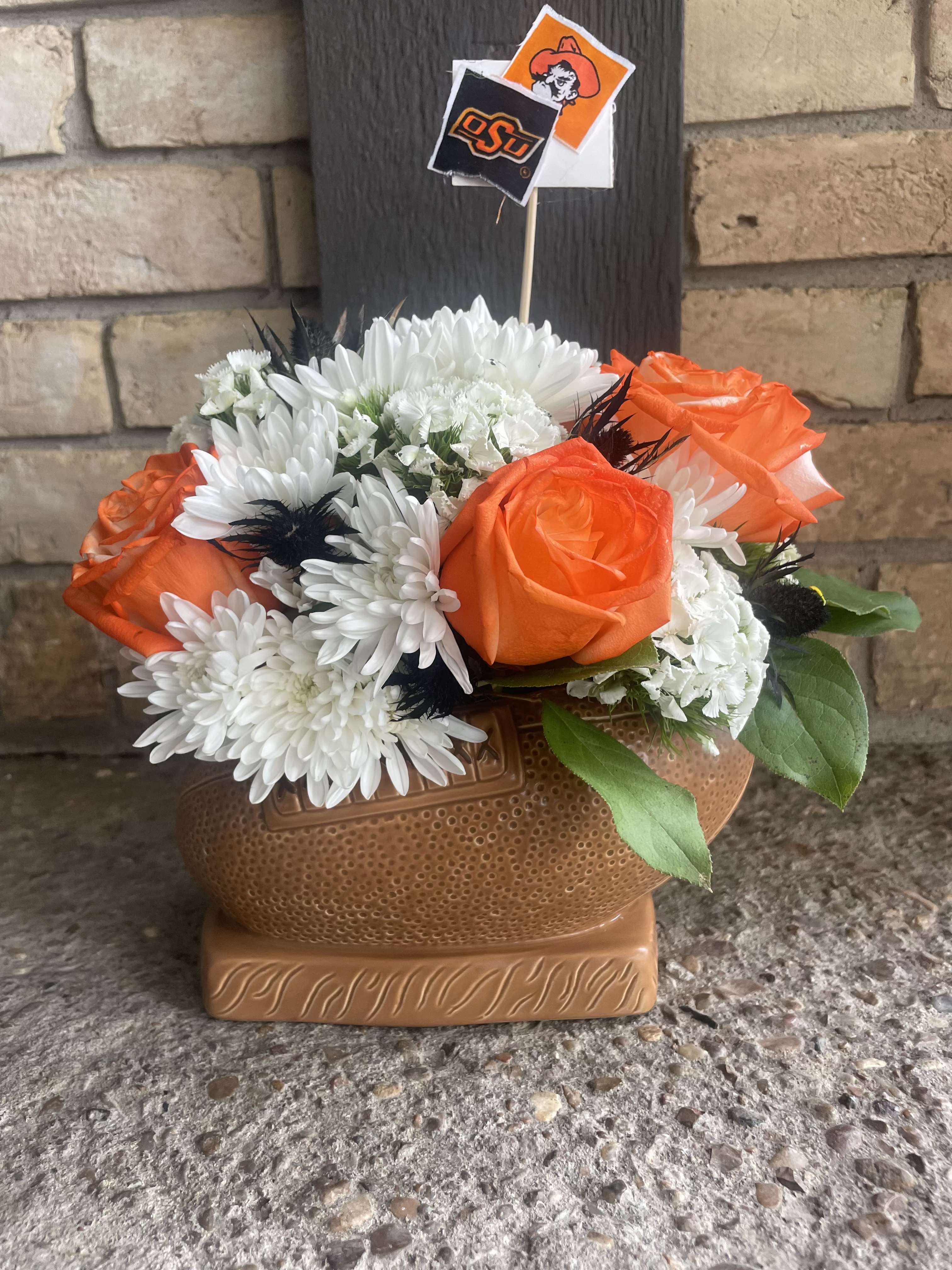Foot ball arrangement  - This ceramic keepsake foot ball container Can be made in any color and team theme 