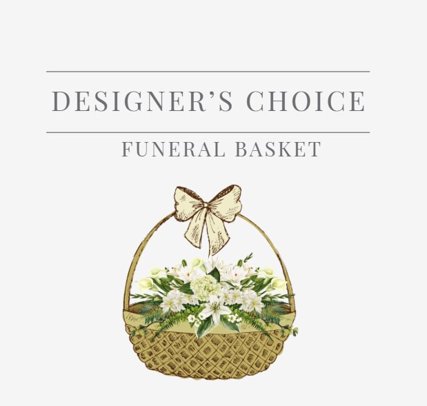 White floral arrangement in a woven basket with a bow