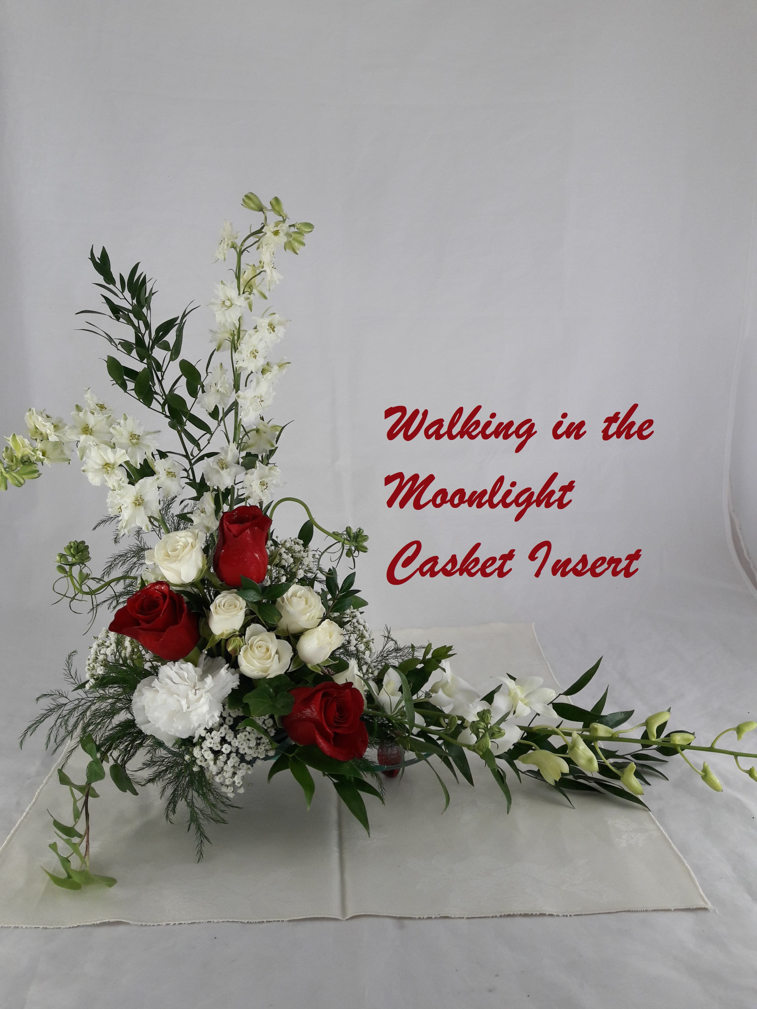 Red and white floral casket insert with long white blooms