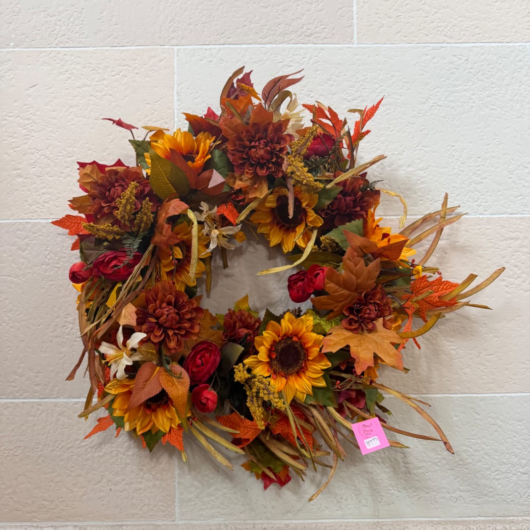 Autumn wreath with sunflowers, burgundy blooms, and fall leaves