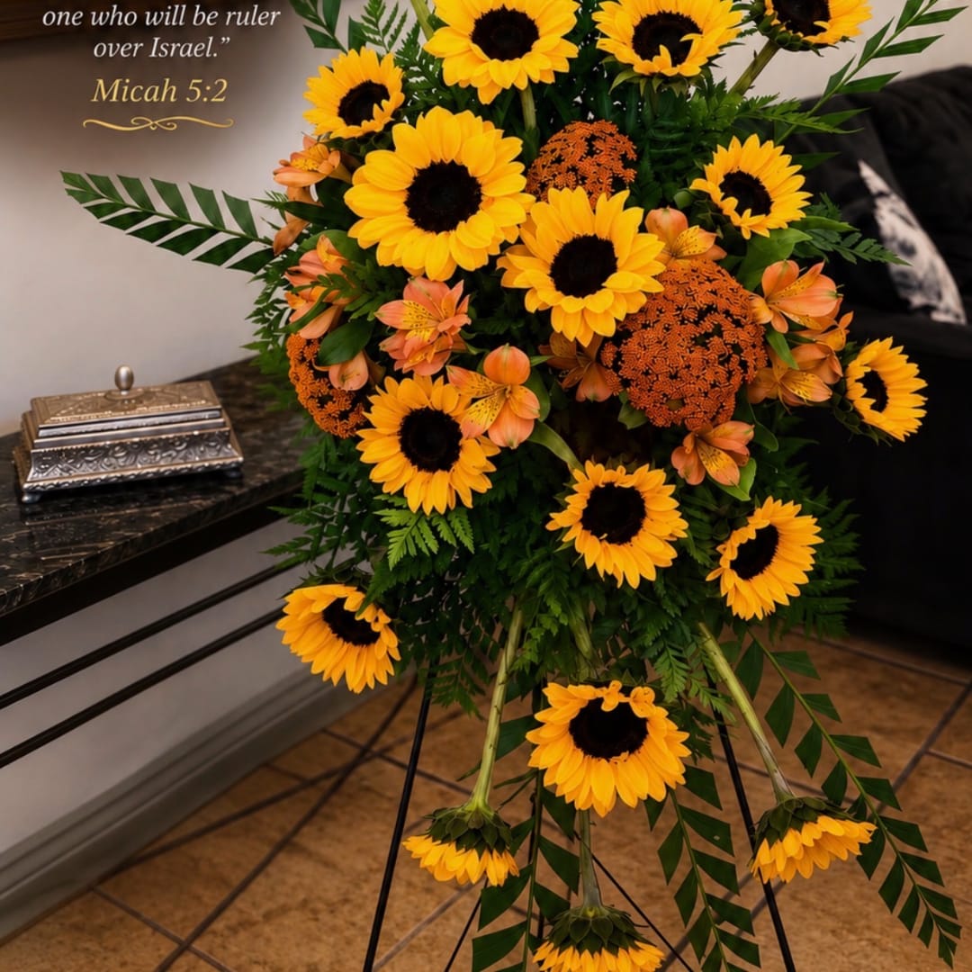 Standing floral spray with sunflowers and orange accent blooms