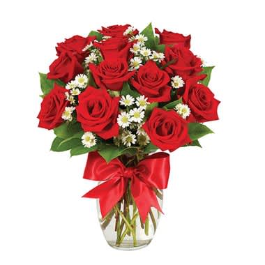 A Dozen Of Red Roses - What else need be said? This is it, the definitive floral masterpiece, the perfect gift...boasting gorgeous roses in red, yellow, pink and bi-color with a pretty red satin ribbon in a rose vase.