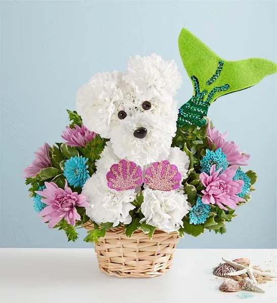 Dog-shaped flower arrangement in a wicker basket with a green fin tail