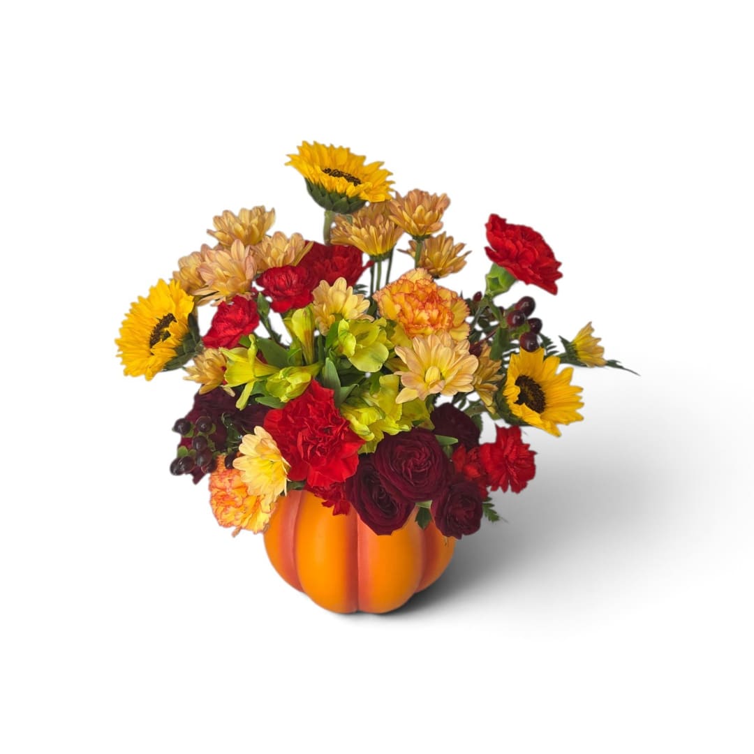 Mixed fall bouquet in an orange pumpkin container
