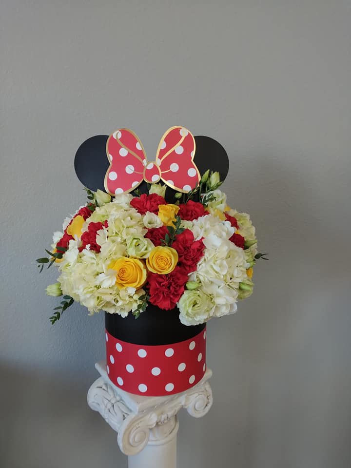 Mickey Mouse-themed flower arrangement in a polka-dot box